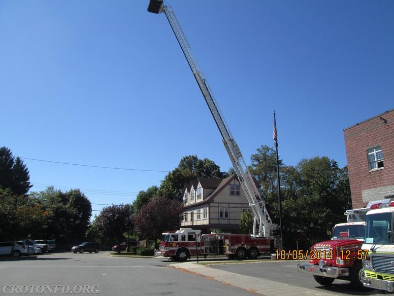 Tower Ladder 44 With The Ladder Extended Up
In The Sky   