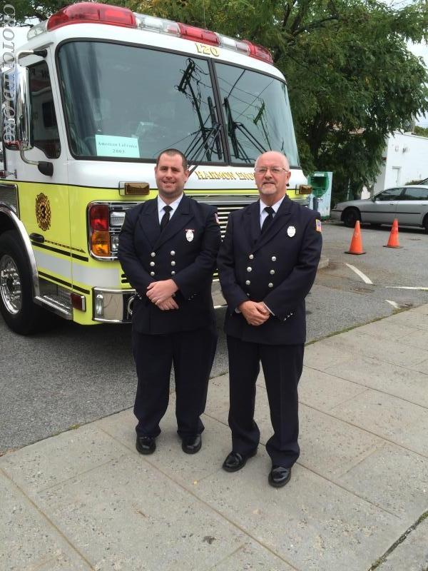 Firefighter Jim Powers And His Dad Take Photo In  Front Of Engine 120 At The 2015 Inspection At Harmon Firehouse 