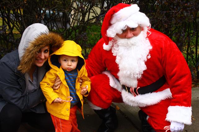 Santa visits Chief Munson's wife and son during the 2012 Candy Cane Run.