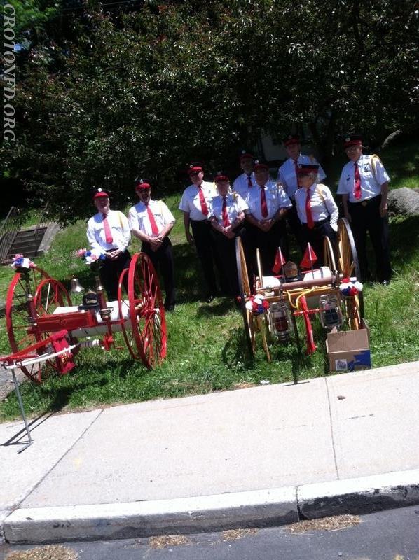 Members of the CFD with &quot;Yesterday's Fires'&quot; hose carts.  Photo by J. Powers