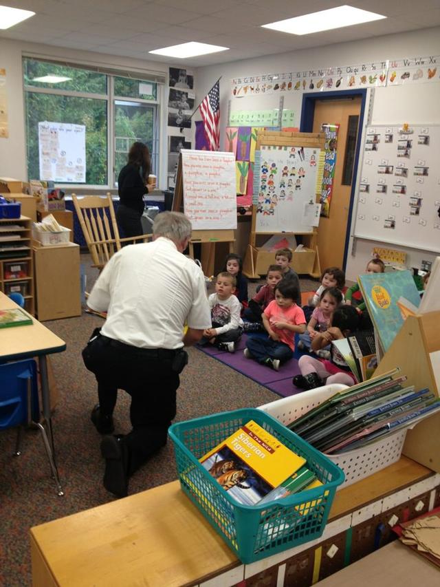 Deputy Chief Tex Dinkler speaks to a Kindergarten class at CET School during Fire Prevention Week 2012.